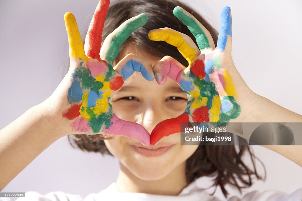 Painted hands sign heart