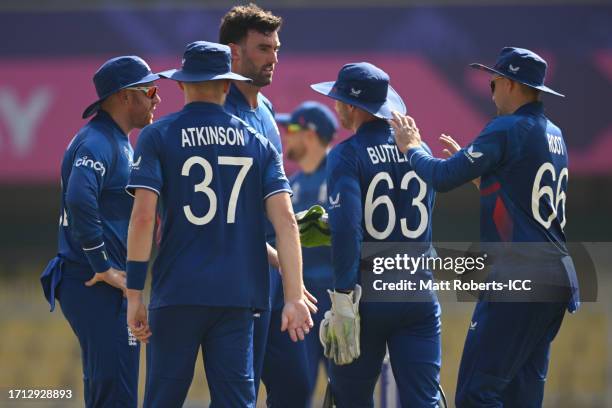 Reece Topley of England celebrates the wicket of Litton Das of Banglasesh during the ICC Men's Cricket World Cup India 2023 warm up match between...