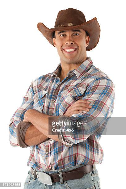 cowboy in piedi con le braccia incrociate - cowboy hat foto e immagini stock