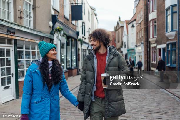 strolling through town - construction material stock pictures, royalty-free photos & images