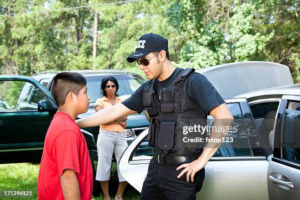 policeman questioning witnesses during crime investigation - crime law and justice stock pictures, royalty-free photos & images