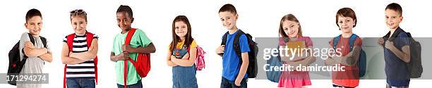 group of happy multi-ethnic school children with backpacks - boy holding picture cut out stockfoto's en -beelden