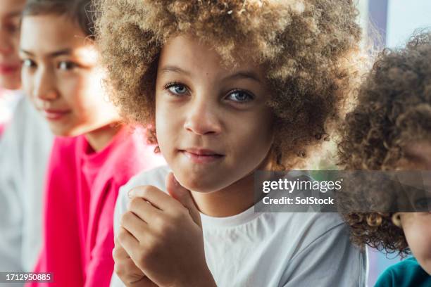 young boy waiting for athletics training - human age stock pictures, royalty-free photos & images