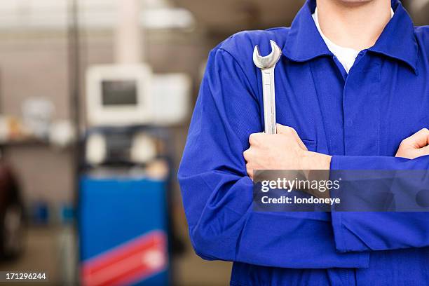 mechanic holding wrench - wrench stock pictures, royalty-free photos & images