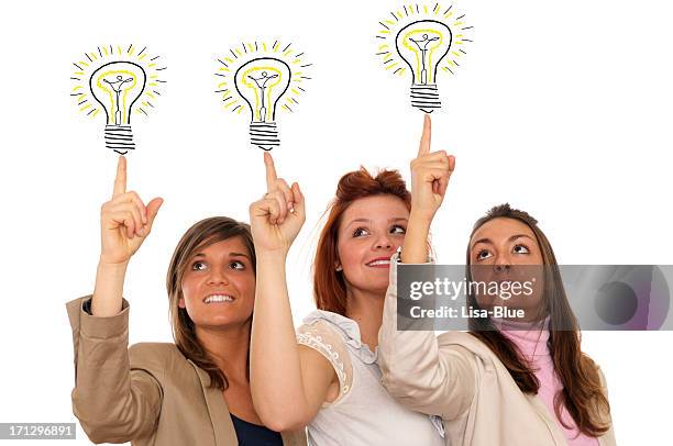 young women pointing light bulbs - girl pointing bildbanksfoton och bilder