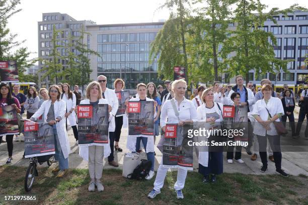 Striking medical physicians gather before marching to protest against working conditions and the health sector reform proposals of the federal...