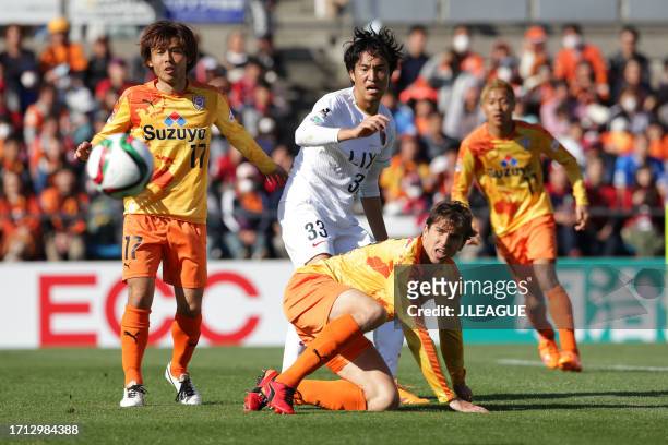 Mu Kanazaki of Kashima Antlers competes for the ball against Yosuke Kawai and Dejan Jakovic of Shimizu S-Pulse during the J.League J1 first stage...
