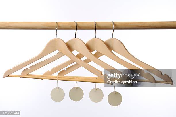 wooden coat hanger with blank tag against white background - coat rack stock pictures, royalty-free photos & images