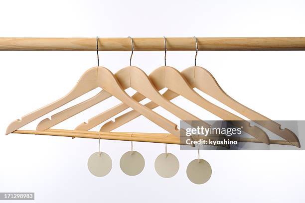 wooden coat hanger with blank tag against white background - white coat fashion item stock pictures, royalty-free photos & images