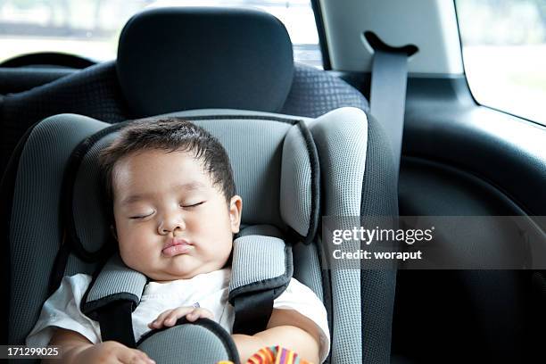 baby boy in car seat - baby car seat stock pictures, royalty-free photos & images