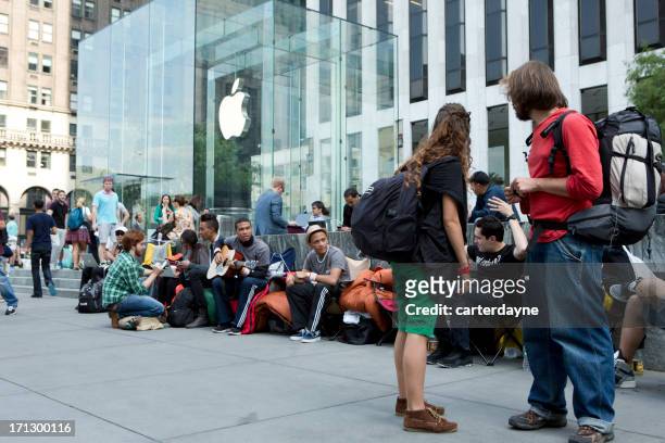 iphone 5 lines at flagship apple store new york city - apple store new york stock pictures, royalty-free photos & images