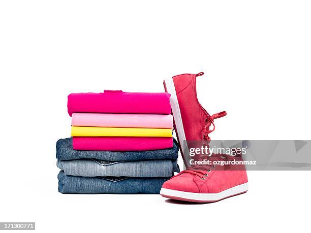 casual clothes folded in pile on white - closet shelf of colorful folded clothes stockfoto's en -beelden