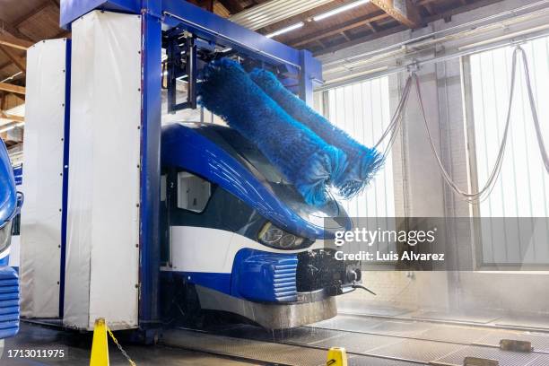 train cleaning at drive through washing system at railway maintenance workshop - drive through car wash stock pictures, royalty-free photos & images