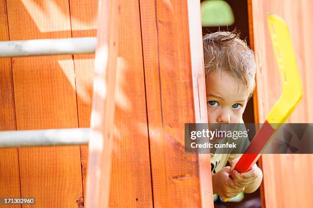 child with stick - kids ice hockey stock pictures, royalty-free photos & images