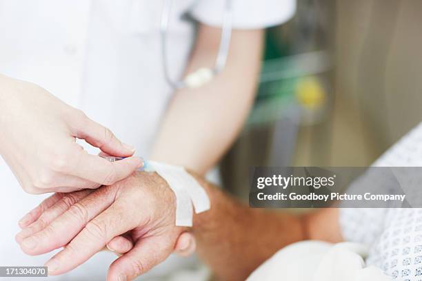 as treatment begins - iv drip womans hand stock pictures, royalty-free photos & images