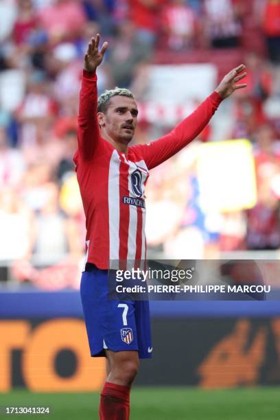 Atletico Madrid's French forward Antoine Griezmann celebrates victory at the end of the Spanish league football match between Club Atletico de Madrid...