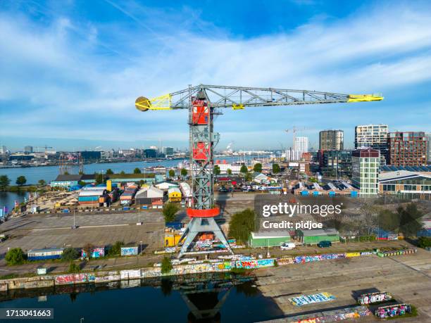 the old, disused ndsm shipyard in north amsterdam, netherlands is now a creative space for artists - shipyard stock pictures, royalty-free photos & images