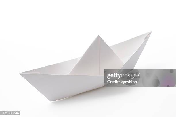 isolated shot of blank paper boat on white background - origami stockfoto's en -beelden