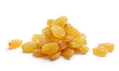Bunch of golden yellow raisins isolated on white background