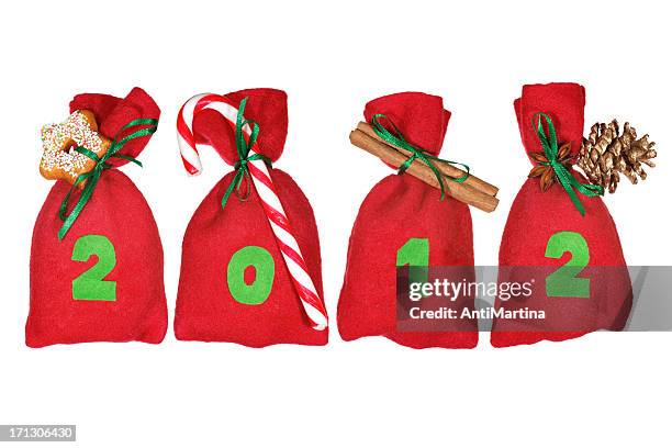 red christmas bags (year 2012) isolated on white - adventkalender stock pictures, royalty-free photos & images