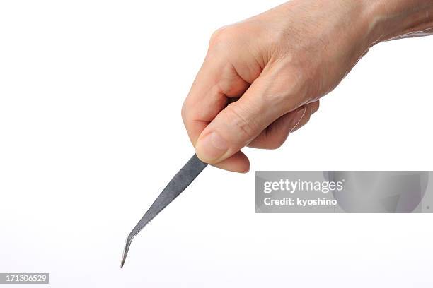 isolated shot of holding tweezers on white background - tweezers stock pictures, royalty-free photos & images