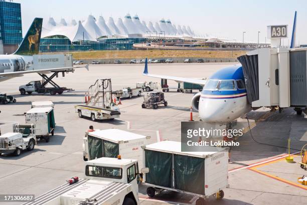 busy denver international  airport gate activity - denver airport stock pictures, royalty-free photos & images
