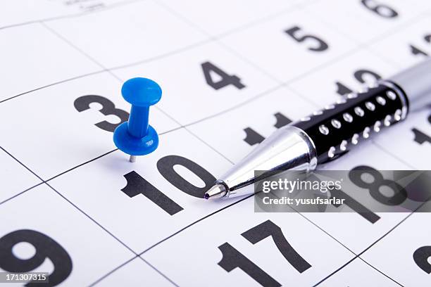 blue pin on calendar with pen - 10 stock pictures, royalty-free photos & images