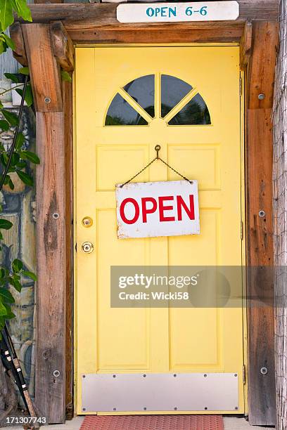 yellow front door with signs - door number 6 stock pictures, royalty-free photos & images