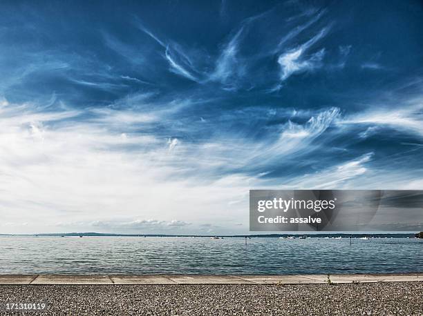 lake constance with dramatic sky - promenade stockfoto's en -beelden