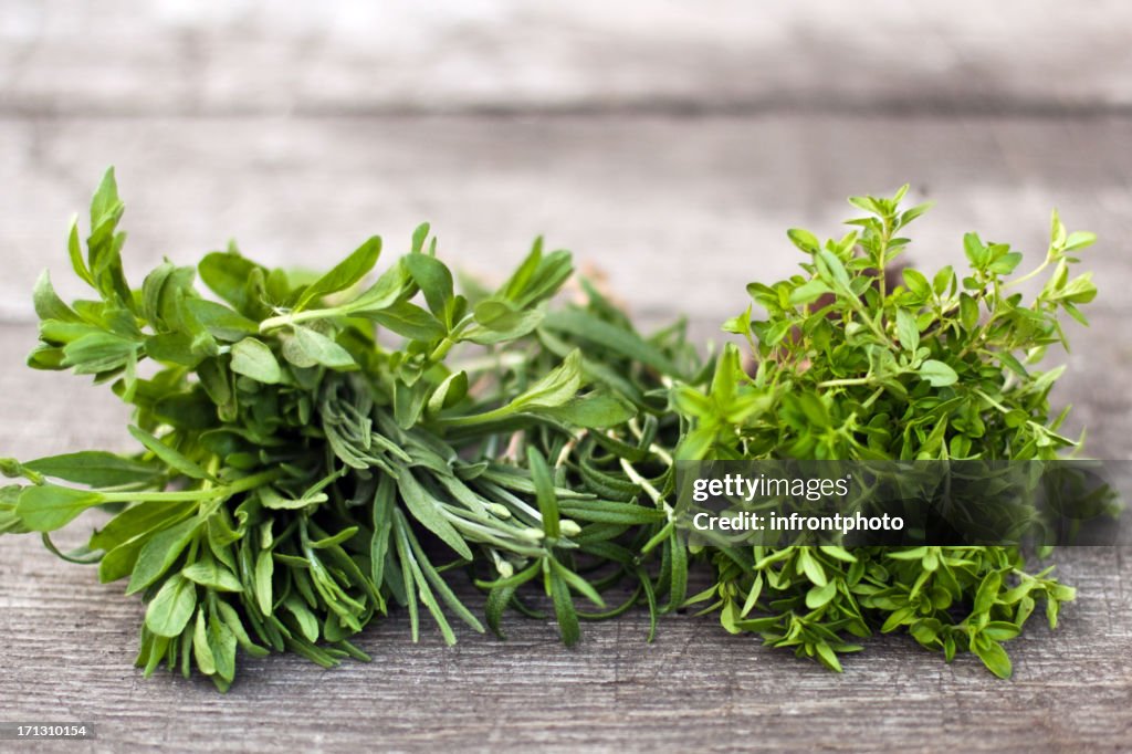 Fresh herbs on an old wooden table