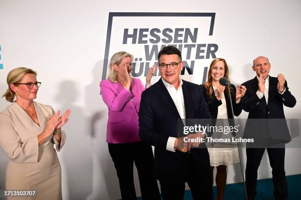 Boris Rhein, lead candidate of the German Christian Democrats , is joined by his wife Tanja Raab-Rhein , as he speaks to supporters at the CDU...