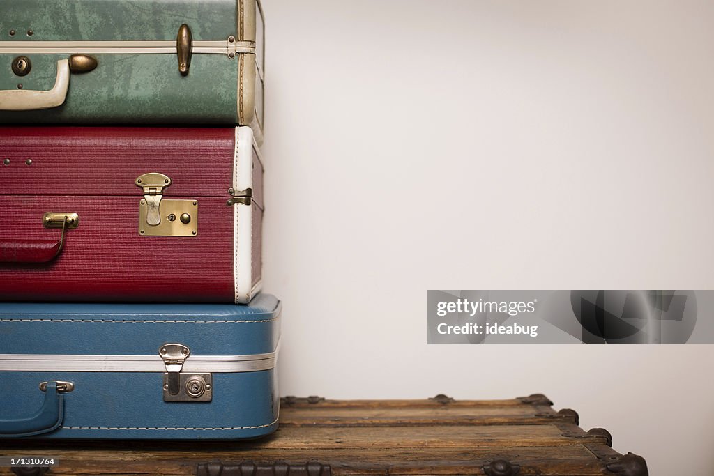 Stack of Retro Suitcases, Sitting on Wood, With Copy Space