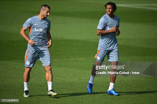 Henrikh Mkhitaryan of FC Internazionale and Juan Cuadrado of FC Internazionale reacts during the FC Internazionale training session at the club's...