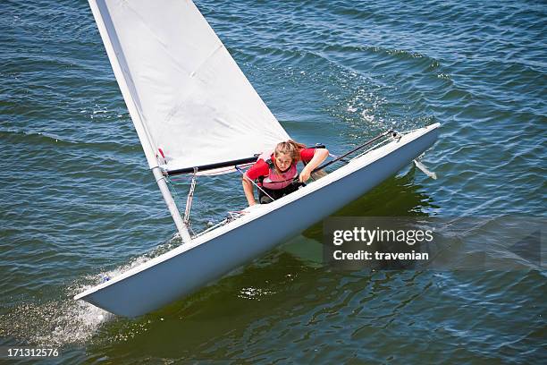 girl sailing dinghy - woman sailing stock pictures, royalty-free photos & images