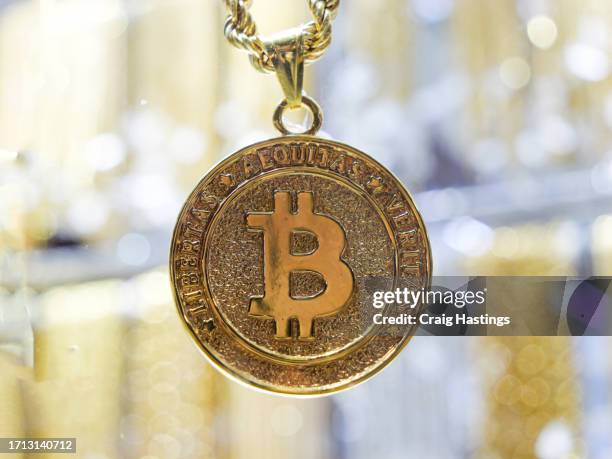 dubai uae - solid gold bitcoin medallion with crypto currency emblem - medallion stock pictures, royalty-free photos & images