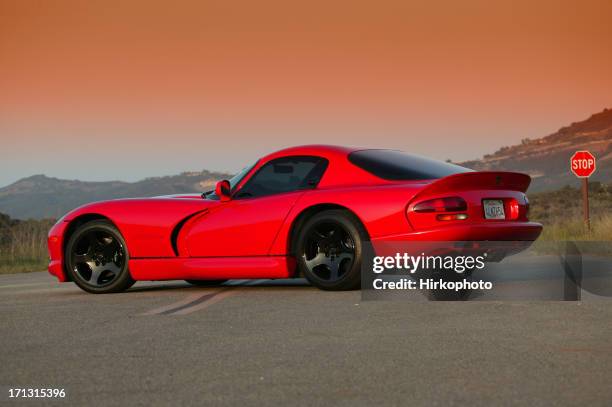 dodge viper gts on double yellow with stop sign - dodge stock pictures, royalty-free photos & images