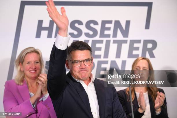 Hessen's State Premier and top candidate of the conservative Christian Democratic Union party Boris Rhein waves his supporters at the State...