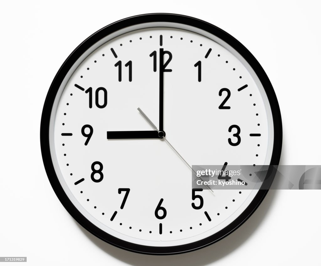 Isolated shot of 9 O'Clock clock face on white background