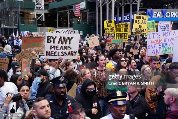 People rally in support of Palestinians in Times Square in New York on October 8, 2023 after the Palestinian militant group Hamas launched an attack...