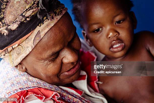 xhosa grandmother and granddaughter in rural south africa - xhosa culture stock pictures, royalty-free photos & images