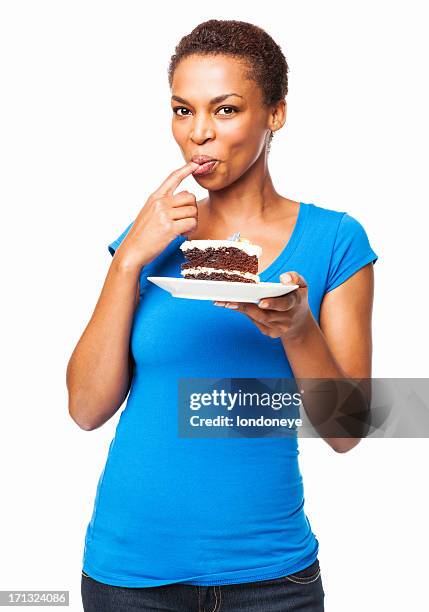 african american woman tasting chocolate cake- isolated - black plate stock pictures, royalty-free photos & images