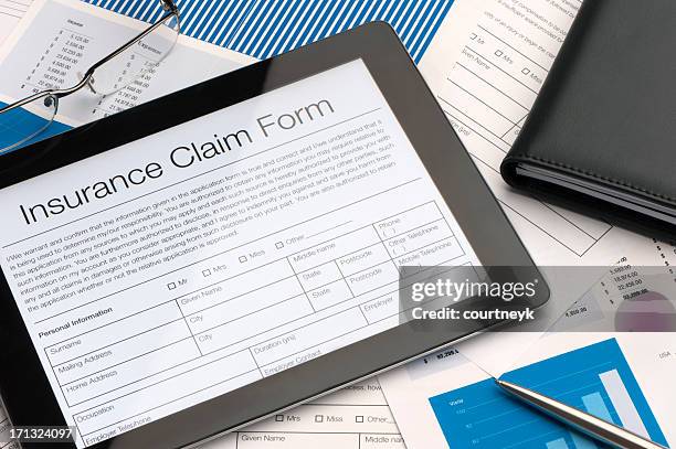 online insurance claim form - insurance document stock pictures, royalty-free photos & images