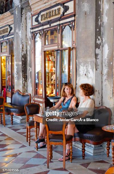 tourists at old venetian cafe - cafe florian stock pictures, royalty-free photos & images