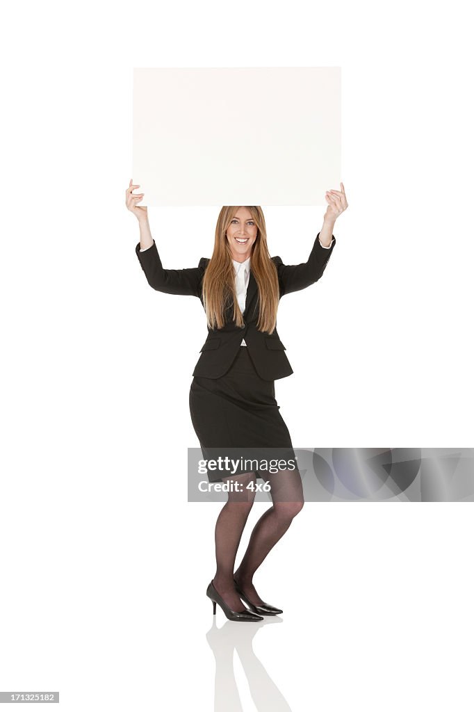 Businesswoman holding a placard