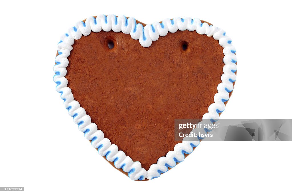A gingerbread cookie in the shape of a heart