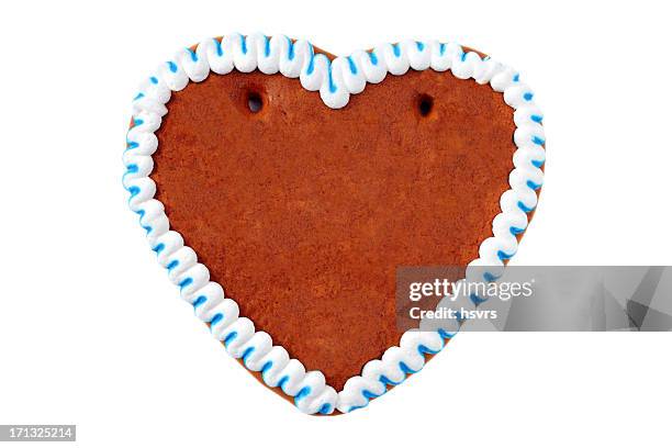 a gingerbread cookie in the shape of a heart - gingerbread stock pictures, royalty-free photos & images