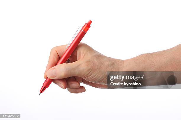 writing with the red ball point pen on white background - balpen stockfoto's en -beelden