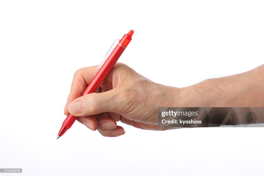 Writing with the red ball point pen on white background