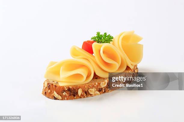 bread with cheese - slice of food stock pictures, royalty-free photos & images