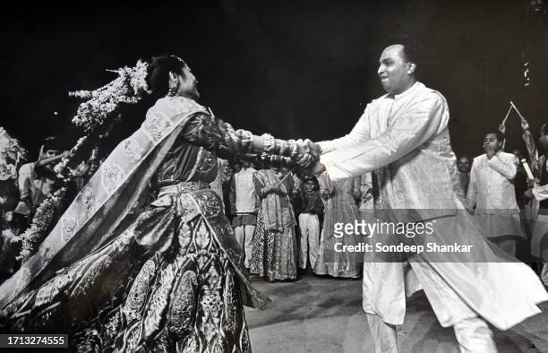 Anil Ambani, the younger son of Indian business tycoon Dhirubhai Ambani who founded Reliance Industries dancing the traditional 'Garba' dance from...